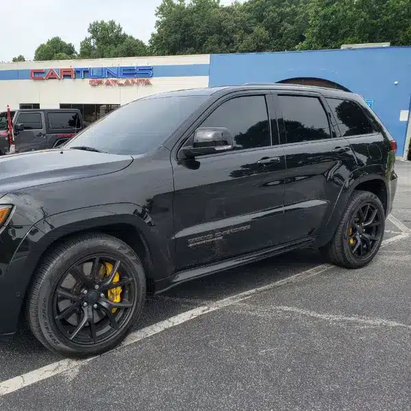 all black SUV with very dark tinted windows